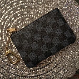 Black checkered card and key wallet with key chain attached!